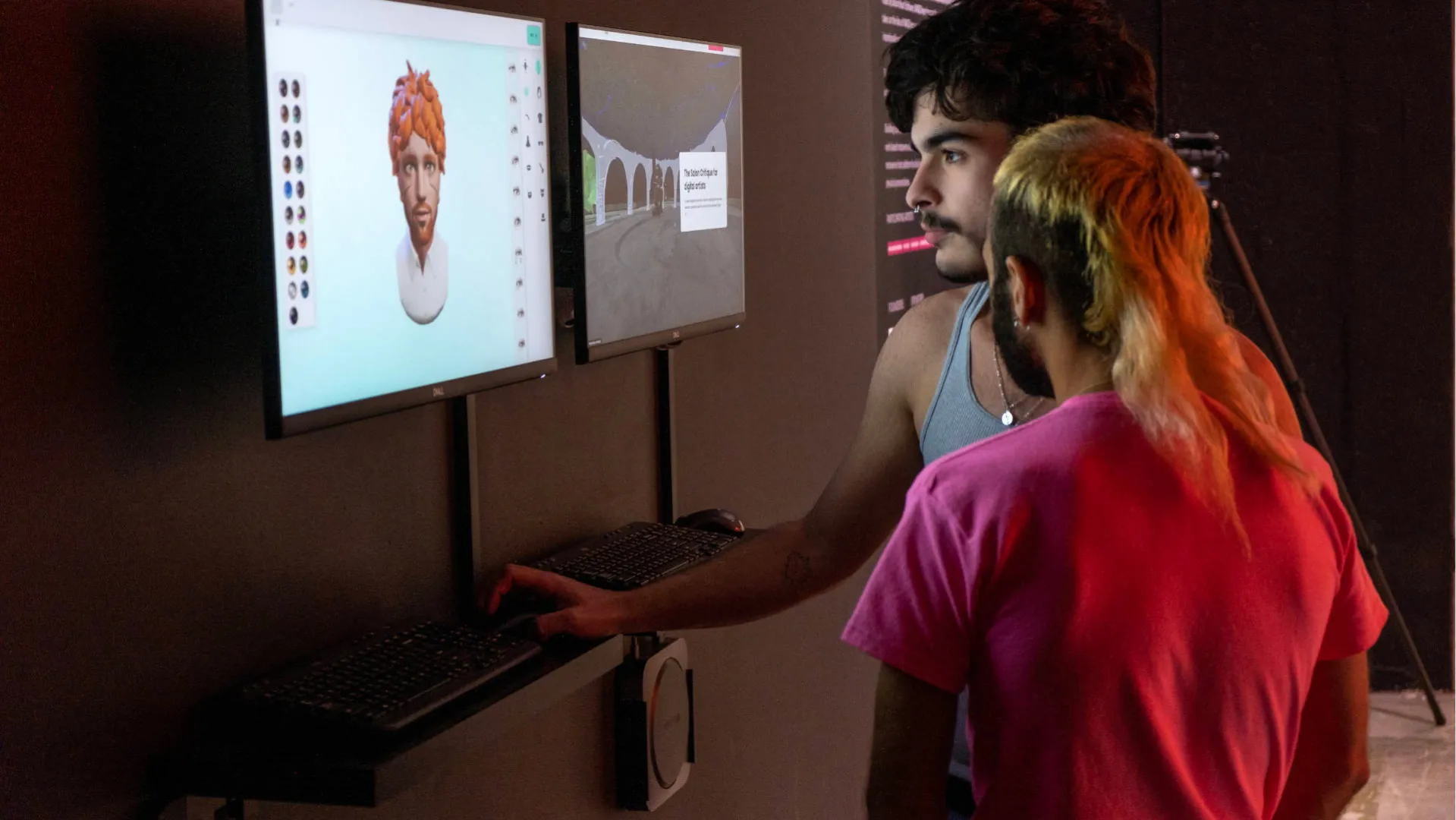 Two persons creating an avatar at the Media Under Dystopia Exhibition
