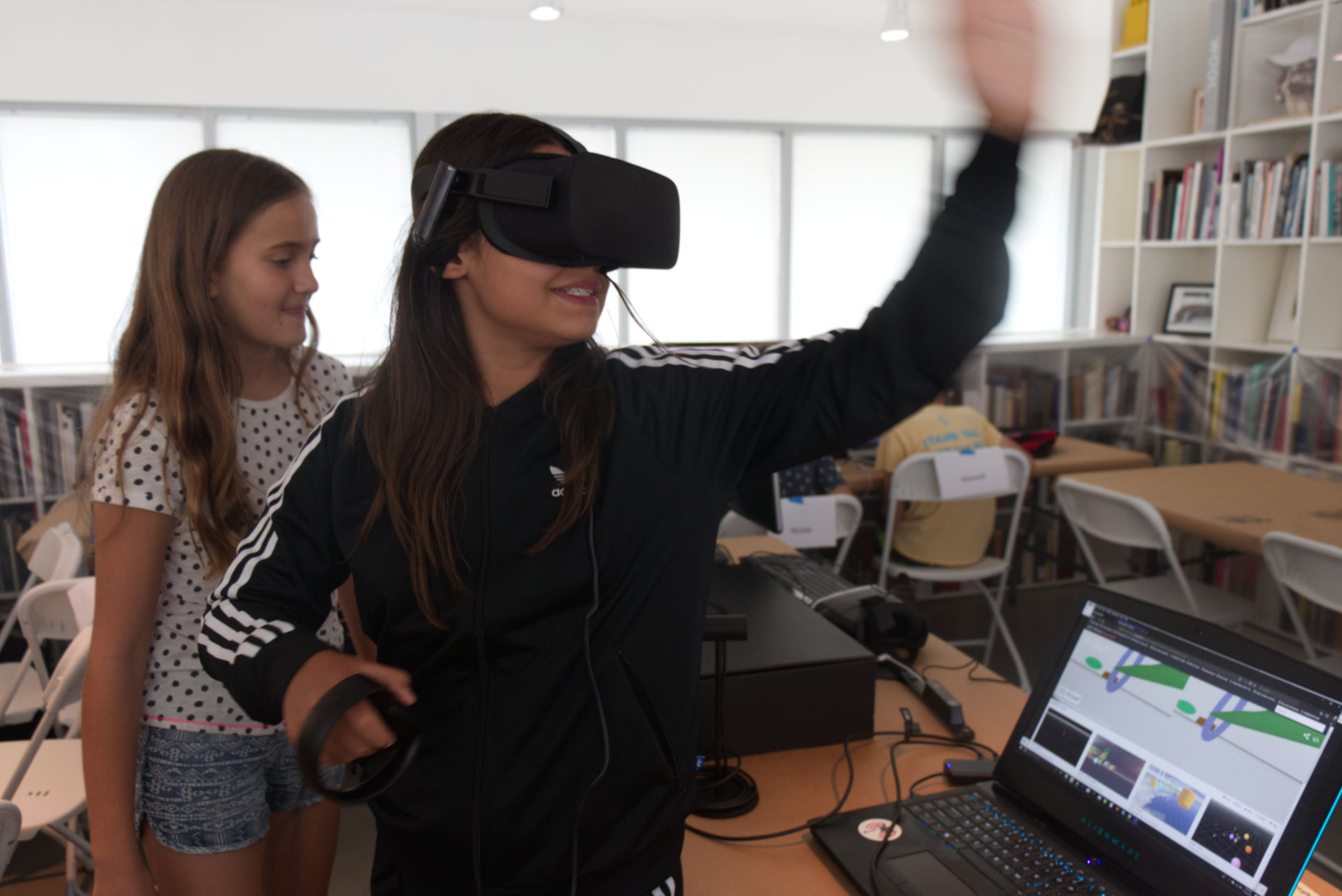 Two girls at XRcamp using Oculus